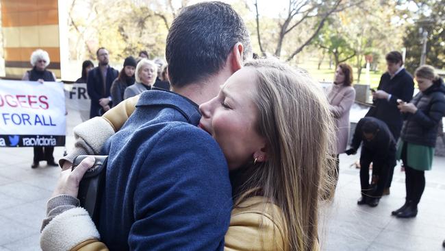 Former Australian of the Year Grace Tame hugs Mostafa Azimitabar outside the Federal Court. Picture: Andrew Henshaw