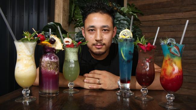 Mixologist Simon Tamrakar with some of the colourful mocktails at Yagoona’s new Kaffeine & Co. Picture: Robert Pozo