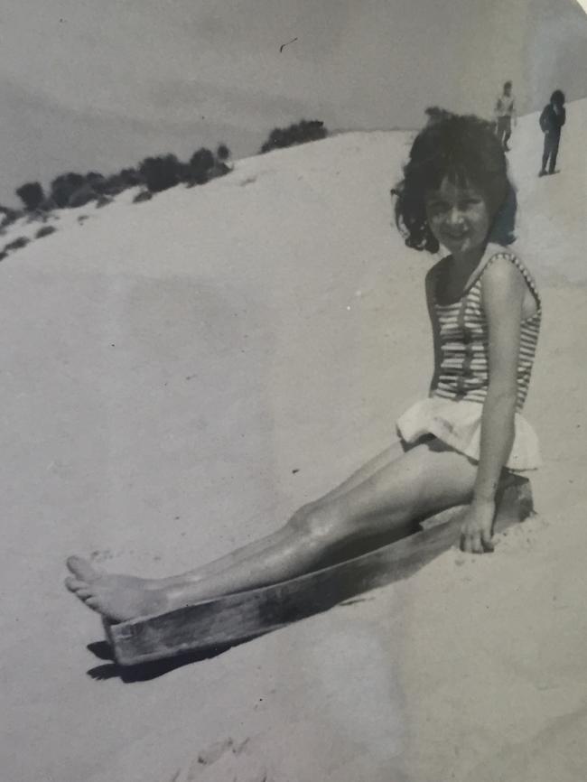 Pene O’Dea (nee Robinson), whose parents ran the kiosk and boatshed, goes for a slide in 1972.