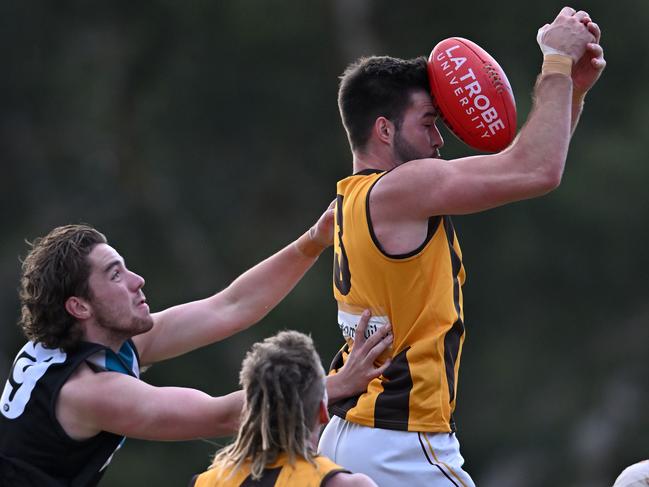 NFL: Lower Plenty’s Tom Blake cops a falcon. Picture: Andy Brownbill