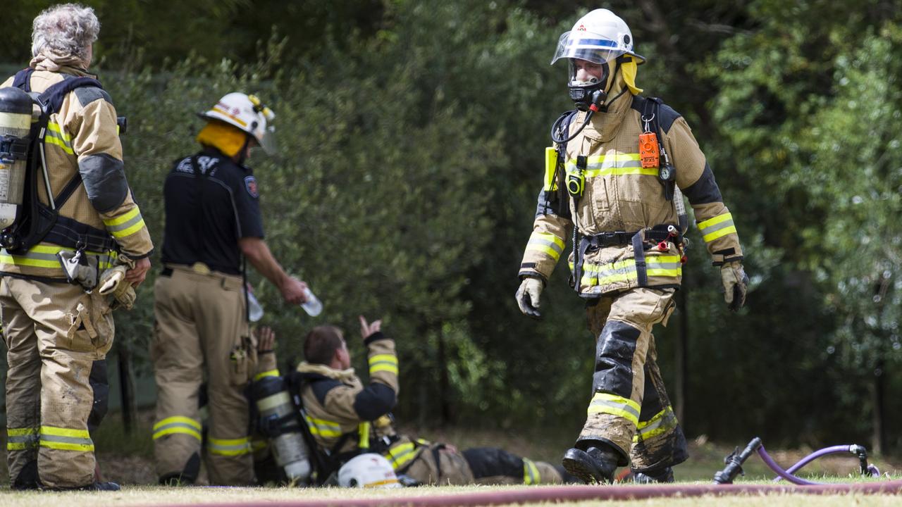 Firefighters were treated for heat exhaustion following a house fore at Withcott on Sunday afternoon, January 22. Picture: Kevin Farmer