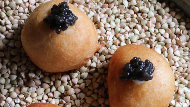 Miss Moneypenny’s savoury doughnuts with smoked creme fraiche and caviar. Picture Glenn Hampson