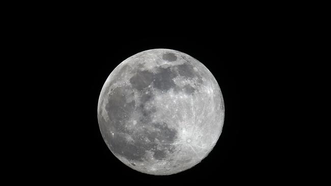 A supermoon occurs when the moon reaches its closest position to the Earth, known as the perigee, making the satellite appear bigger and brighter than usual. This month's supermoon is also a Pink Moon, so-called by the Native Americans because of the pink flowers that appeared in the east of North America at this time of year. (Photo by Chris Jackson/Getty Images)