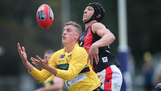 Eagles’ Nick Hayes marks against West’s Mitch Duval. Picture: Dean Martin