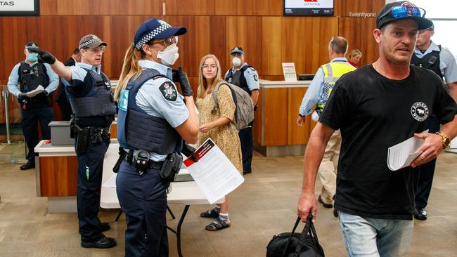 Passengers on the last flight into Adelaide Airport before the South Australian borders were shut in response to the COVID-19 outbreak.