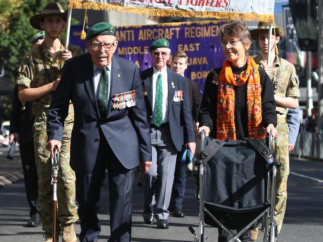 101-year-old John Wilkinson served in PNG, and wanted to walk with his daughter Susie at the Anzac Day March in Sydney. Picture: John Feder