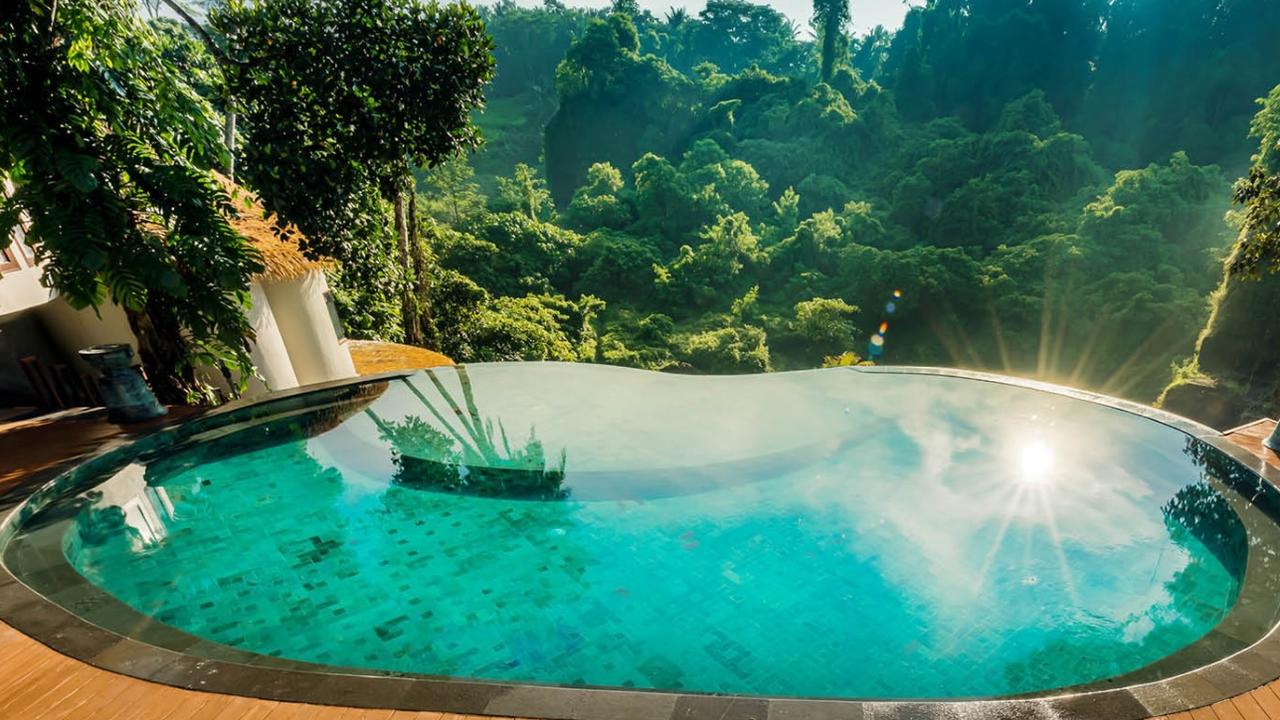 Tanadewa Resort Ubud’s infinity pool is the perfect spot to soak up the region’s famous rainforests. Picture: Trip-A-Deal.