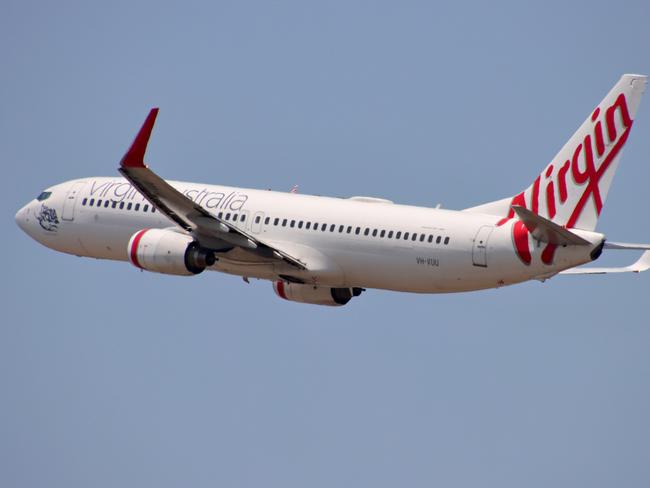 Virgin Australia plane departing from Brisbane Airport Pictures David Clark Photography