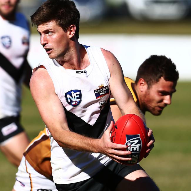 Action from the North Eastern Australian Football League match between Southport (white) and Aspley (yellow), held at Wally Fankhauser reserve, Southport. Photo of Tyson Kruse.