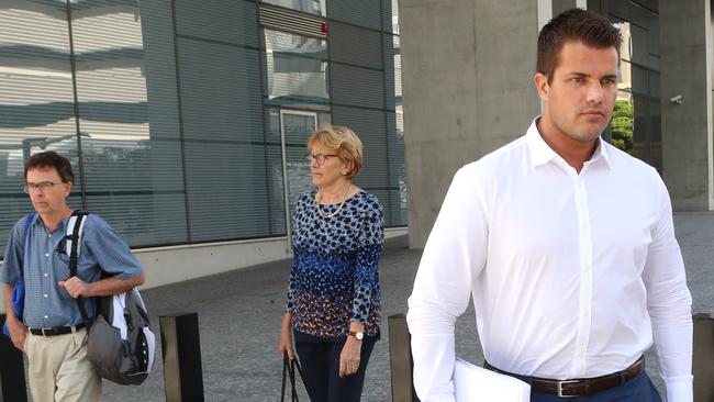 Gable Tostee — now known as Eric Thomas — during his murder trial, leaves court with his parents.