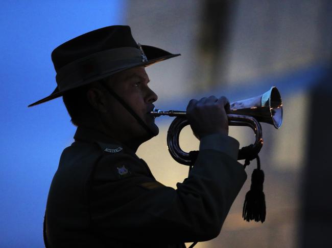 The Last Post played at dawn on the bugle. Anzac Day dawn service at Hobart cenotaph, 2017. Picture: RICHARD JUPE