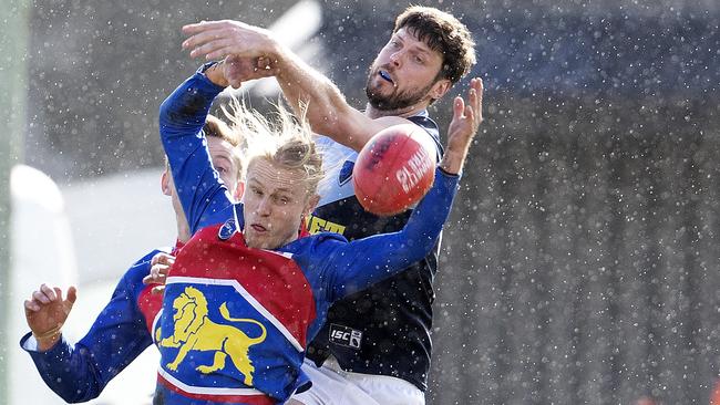 Huonville’s Dylan Hay has his marking attempt spoiled. Picture: Chris Kidd