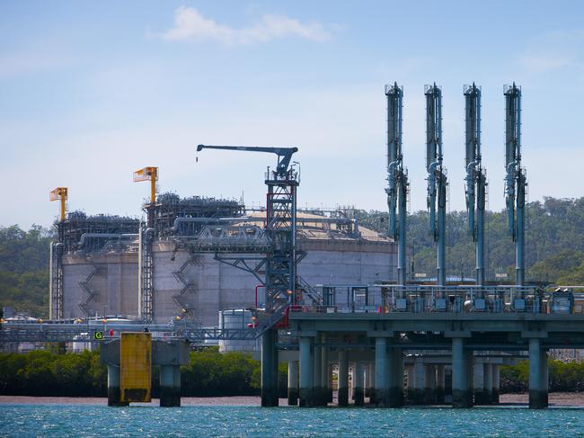 Liquefied natural gas (LNG) storage tanks stand at the Queensland Curtis LNG (QCLNG) project site, operated by QGC Pty, a unit of Royal Dutch Shell Plc, in Curtis Island, Gladstone, Australia, on Wednesday, June 15, 2016. Gas from more than 2,500 wells travels hundreds of miles by pipeline to the project, where it's chilled and pumped into 10-story-high tanks before being loaded onto massive ships. Photographer: Patrick Hamilton/Bloomberg via Getty Images