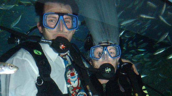 Jason Smith and Janelle Brown dived with the sharks at Sea Life Sunshine Coast to get their wedding photos taken. Picture: Lou O'Brien