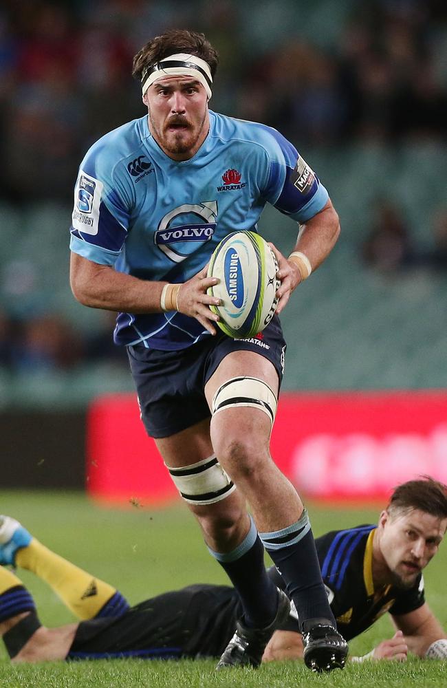 Kane Douglas runs the ball for the Waratahs against the Hurricanes at Allianz Stadium.