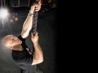 NEW HEIGHTS: Lucas McLean, climbing a rope at Hybrid Gym, competed in Australian Obstacle Course Racing in South Australia. PHOTO: ADAM HOURIGAN