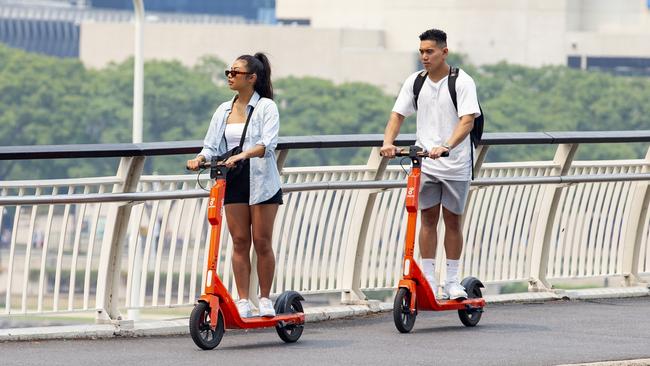 People riding Neuron e-scooters in Brisbane in 2019. Picture: AAP/Richard Walker