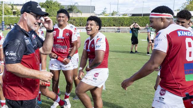 Michael Waqa, far right, and John Fineanganofo, centre laugh after premiership winning coach Shane Tronc was dumped with water last season. Picture: Richard Walker