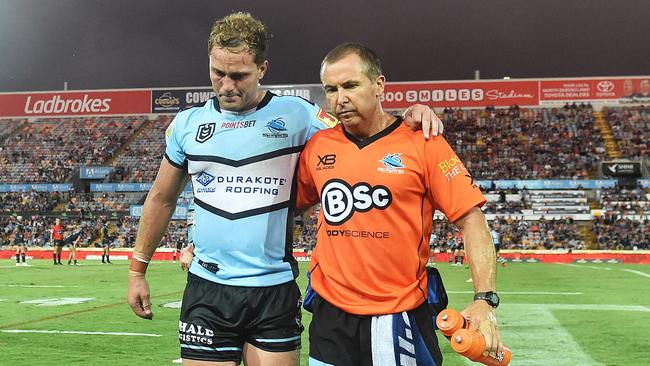 Matt Moylan is helped off the field after injuring his hamstring. Picture: Zak Simmonds