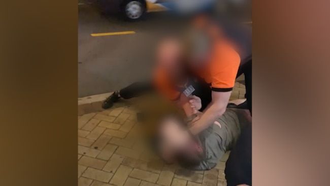 Security guards have been filmed slapping a man outside a Brisbane hotel.