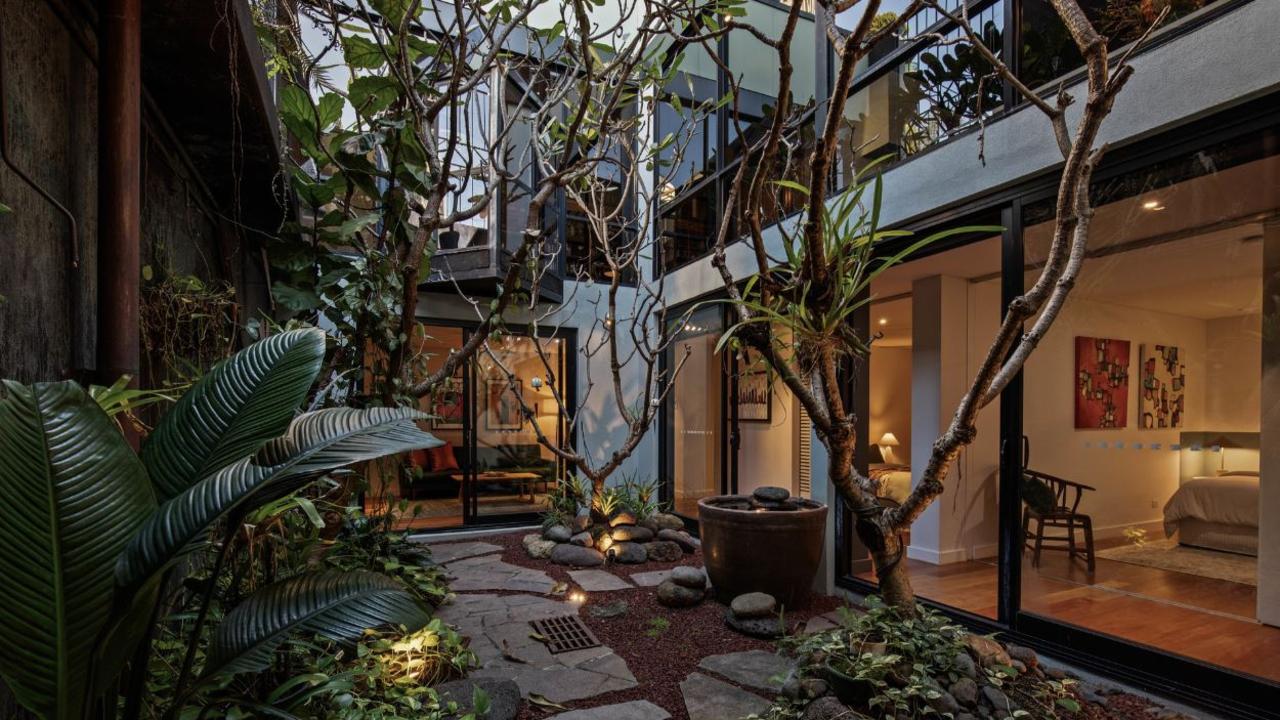 A private garden inside the home offers a quiet and tranquil taste of nature, right by the bustling CBD.