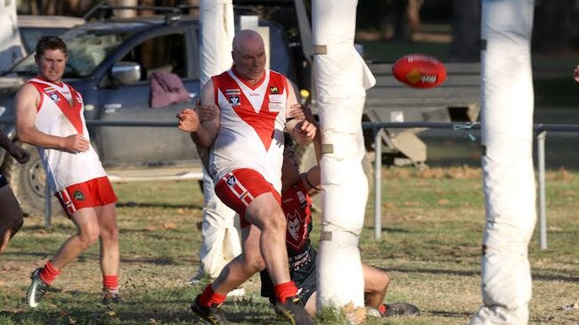 Cameron Tyrell boots a goal for Federal against Corryong in the Upper Murray league. Pictured supplied by Corryong Courier