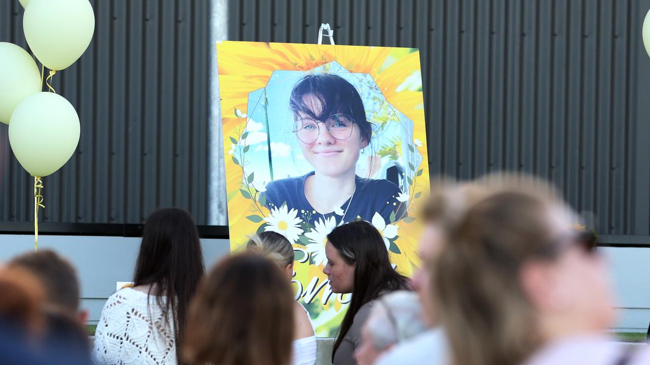 People gather at Rob Akers Reserve for the candlelight vigil for Emily Thompson. Picture: Zak Simmonds