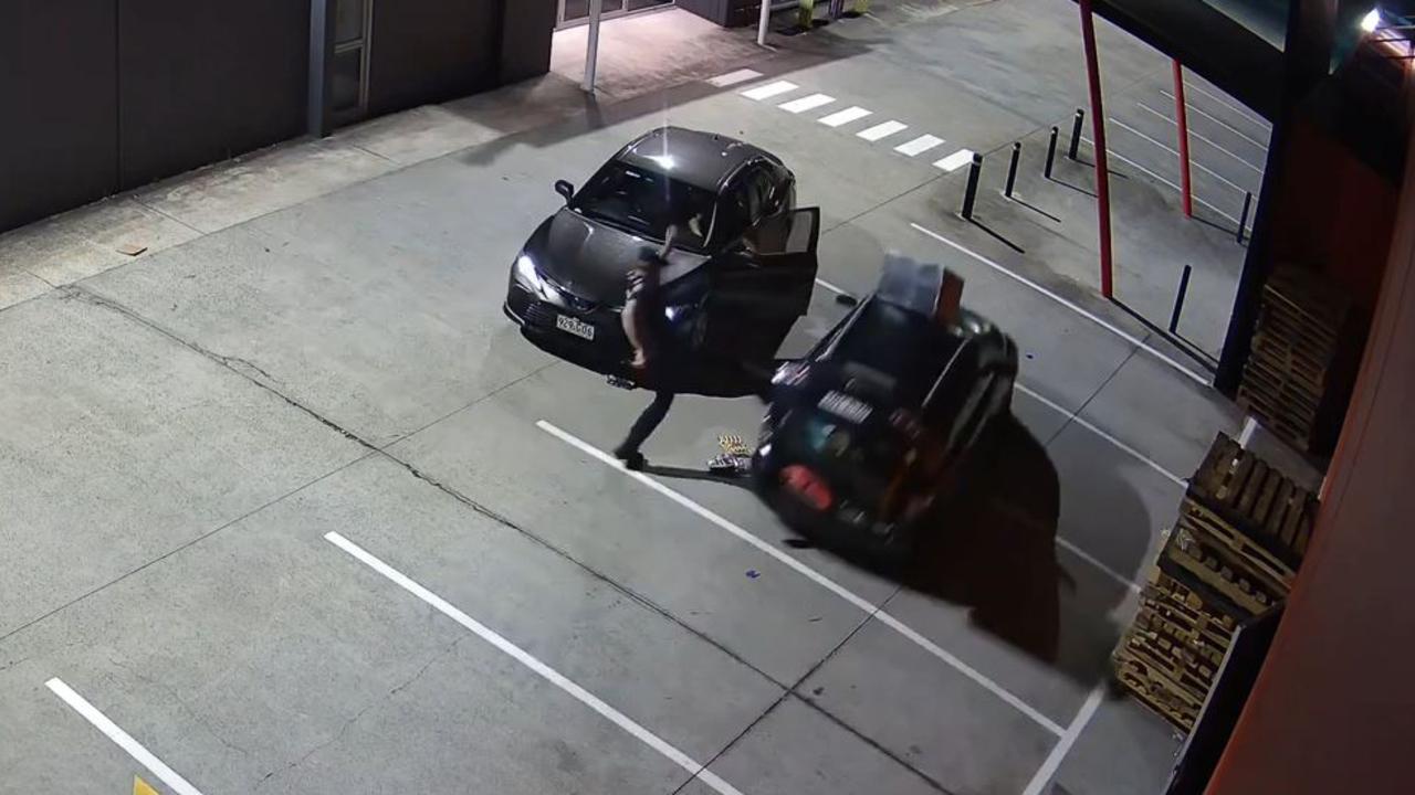 The officer kicks out at the fleeing vehicle.