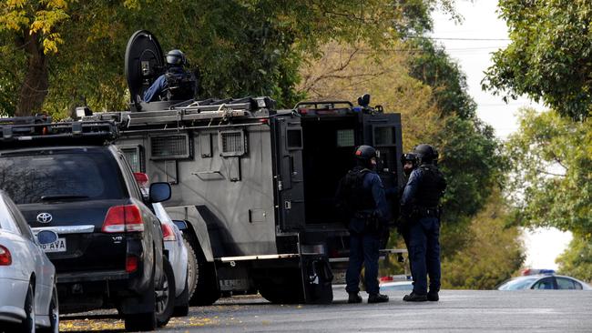 STAR Group officers with an armoured truck during a search for two armed men at Prospect.