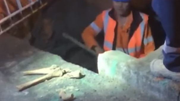 A worker finds bones on the light rail site, near Central station. Picture: 7News