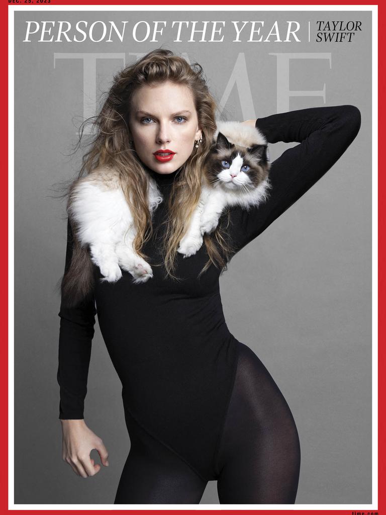 Taylro Swift on the front cover of Time Magazine with her cat. Picture: TIME / AFP
