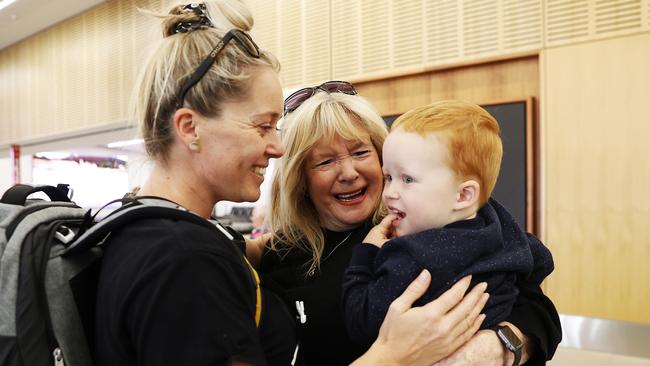 Natalie Simmons and son Hudson Simmons arrive in Hobart to be reunited with her mum Vicki Jesney. Picture: Zak Simmonds