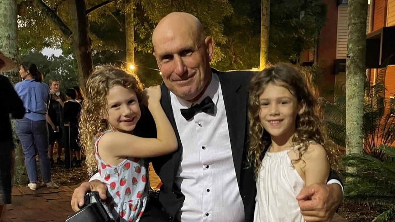 Late Fairholme College teacher John Sessarago with his two daughters.