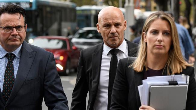 Former NSW Detective Gary Jubelin (centre) arrives at Downing Centre Local Court on Wednesday. Picture: AAP Image/Bianca De Marchi