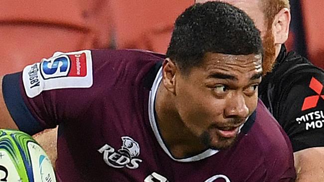 Chris Feauai-Sautia of the Reds (left) is tackled by Jamie Booth of the Sunwolves during the Round 12 Super Rugby match between the Queensland Reds and the Sunwolves at Suncorp Stadium in Brisbane, Friday, May 3, 2019. (AAP Image/Dan Peled) NO ARCHIVING