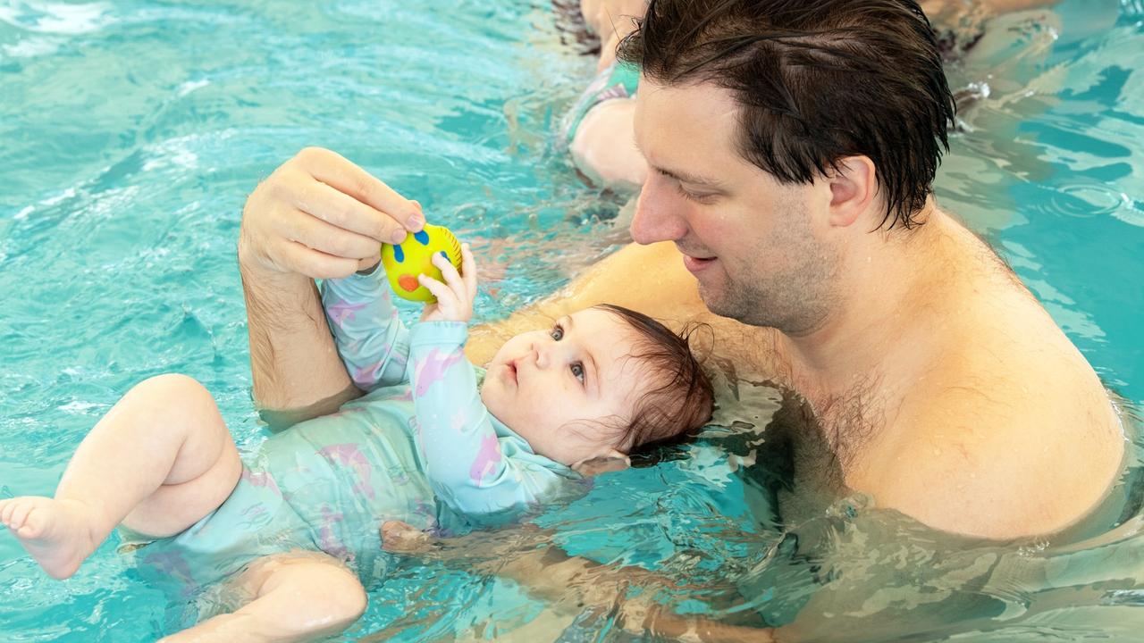 Toddlers receiving free swimming lessons from Bluefit Swimming at the Cotton Tree pool. Pictured, Derek Sanders and young Sierra. Photo: Patrick Woods.