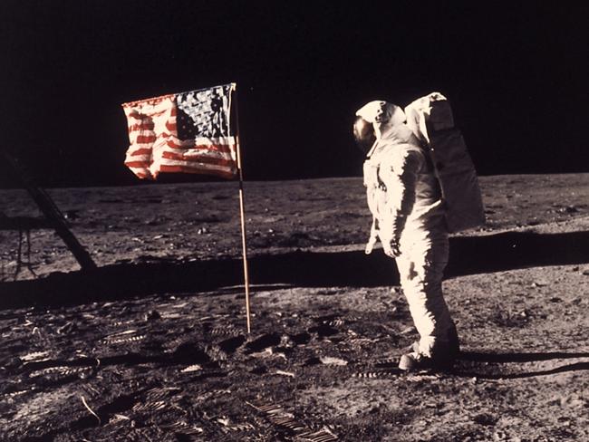 FILE - In this image provided by NASA, astronaut Buzz Aldrin poses for a photograph beside the U.S. flag deployed on the moon during the Apollo 11 mission on July 20, 1969. Television is marking the 50th anniversary of the July 20, 1969, moon landing with a variety of specials about NASA's Apollo 11 mission. (Neil A. Armstrong/NASA via AP, File)