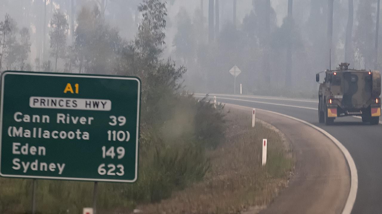 ADF armoured vehicles travelled the Princes Highwayto bring supplies in to Mallacoota, after the coastal town was cut off by fire on New Years Eve, forcing residents and holidaymakers to shelter on the beach. Picture: Getty Images