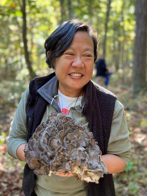 Chef Anita Lo cradles a gigantic hen-of-the-woods mushroom on a Tour de Forks’ foraging expedition at Mama Farm B&amp;B in Brookhaven, N.Y. Picture: Tour de Forks