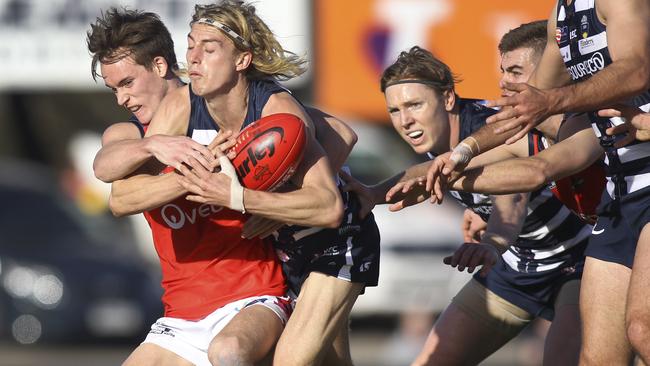 SANFL - South versus Norwood at Noarlunga, Flinders University Stadium. South's Jaidan Kappler tries to escape from Norwood's Cody Szust. 10 June 2019. Picture Dean Martin