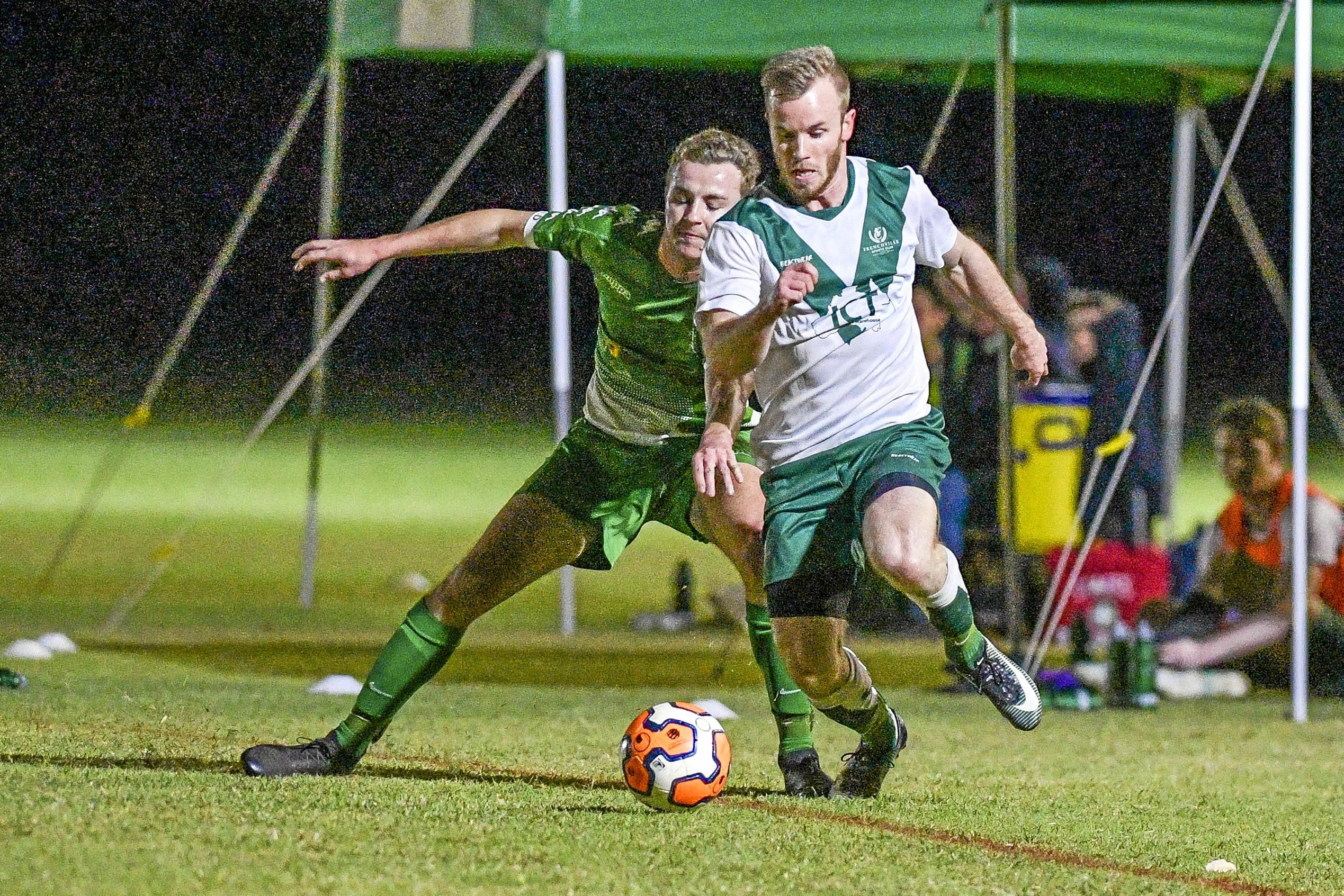 Clinton FC vs frenchville in the Central Queensland Premier League, division one. PICTURED: Frenchville's Jordan miller and Clinton's Joshua Finlay. Picture: Matt Taylor GLA030819SOCC