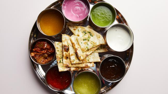 The colourful spread of chutneys and naan make for great beer food