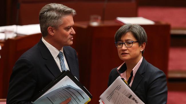 Senator Mathias Cormann and Senator Penny Wong in the Senate Chamber, Parliament House in Canberra. Picture: Kym Smith