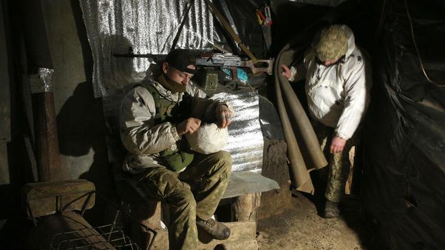 Ukrainian soldiers in a dugout on the frontline with Russia-backed separatists near Gorlivka, in the Donetsk on Sunday. Picture: AFP