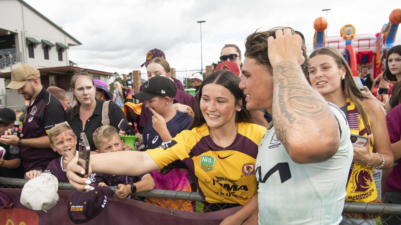 Sienna Hill (left) and Bella Hill pose for a photo with Reece Walsh at the Brisbane Broncos Captain's Run and Toowoomba Fan Day at Toowoomba Sports Ground, Saturday, February 15, 2025. Picture: Kevin Farmer