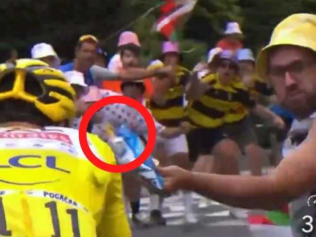 The Professional Cyclists Association has threatened to take legal action after a spectator threw chips at two cyclists during stage 14 of the Tour de France on Saturday.