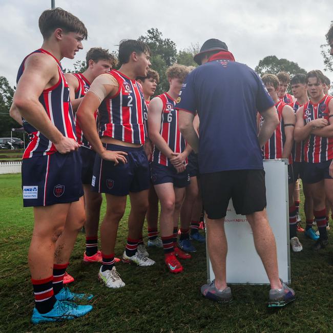 Jackson Williams, No.2 on the left, listens to instructions against Coorparoo - he kicked three at the weekend. Photos by Stephen Archer