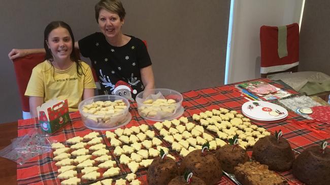 Tradition: Alyssa Christou and her grandmother, Debbie Parry from Kyabram. Debbie makes a mountain of shortbread every Christmas for family, friends and charity. Now she is teaching her granddaughter.