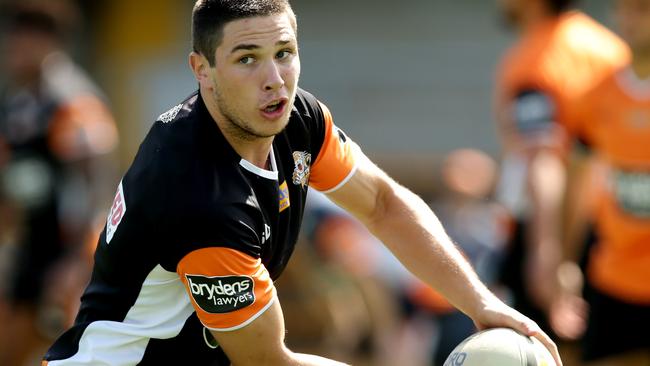 Mitchell Moses looks to throw a pass at Tigers training.