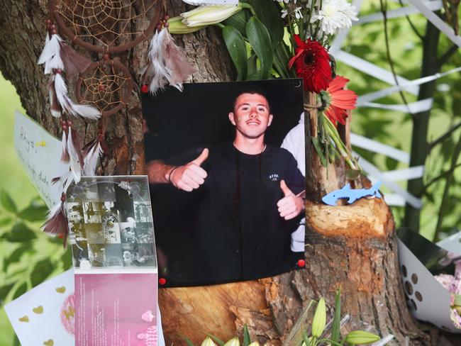 Tributes left on the tree where Rhys Morris died in a car crash on Saturday 21st March 2020 in the early hours of the morning .(AAP Image/Sue Graham)